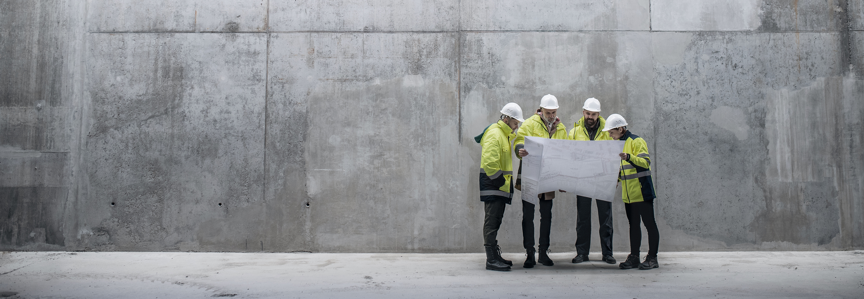 Image of construction workers looking over plans