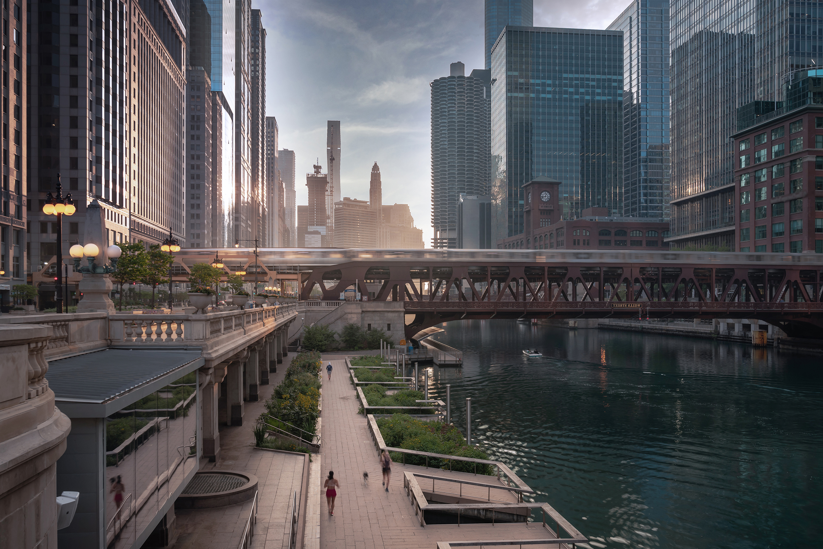 City river walkway with skyscrapers in the background